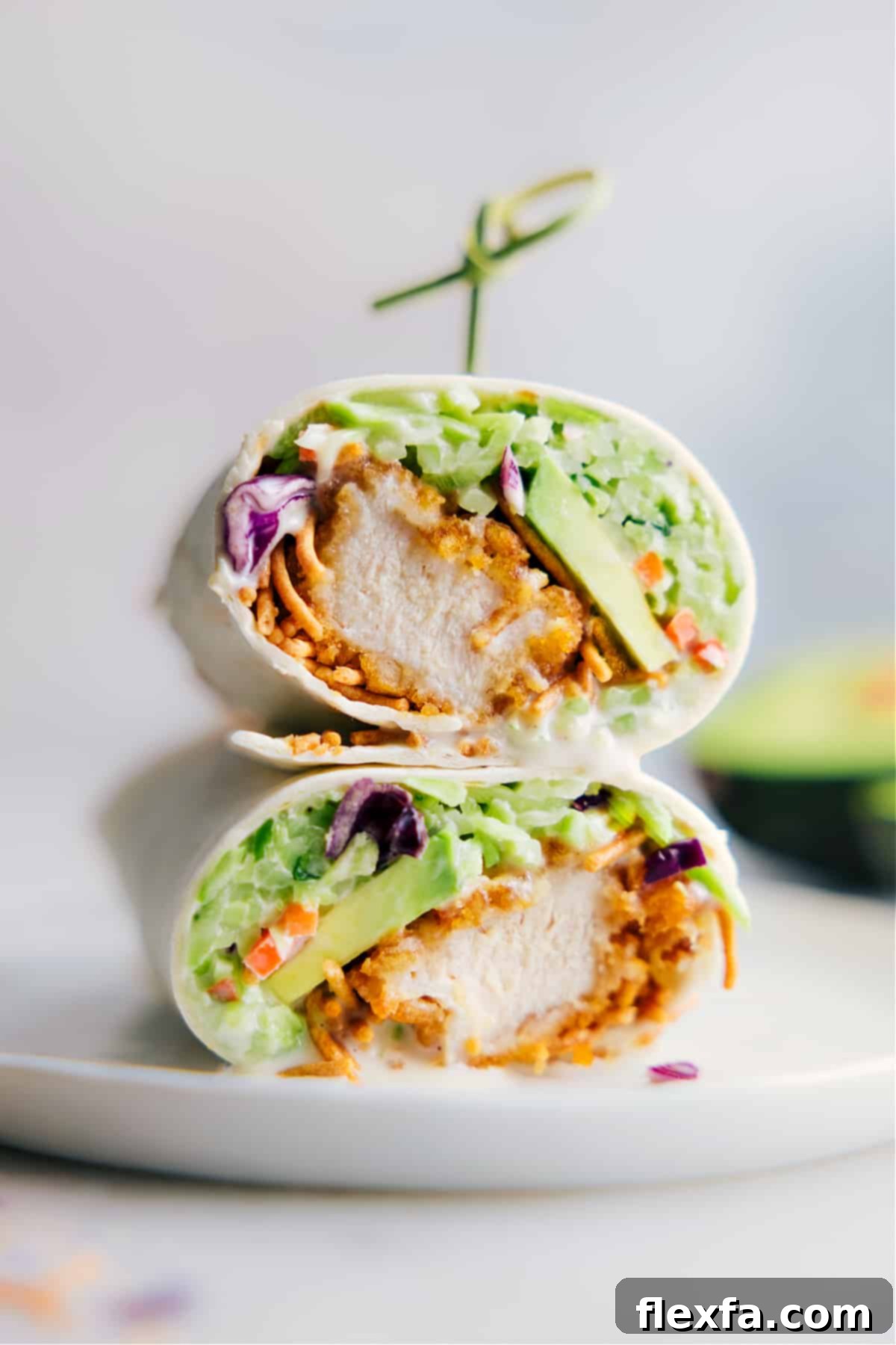 Fresh and vibrant Asian Chicken Wraps, featuring crispy chicken, crunchy slaw, and chow mein noodles.