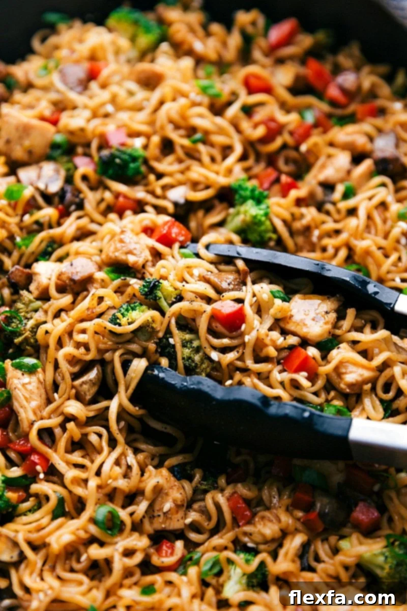 A delicious skillet of 30-minute chicken ramen, complete with noodles, vegetables, and chicken, ready to be served.