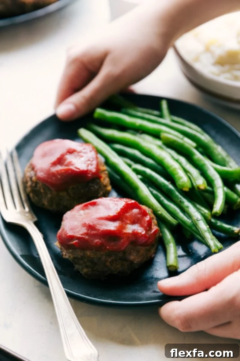 Healthy ground beef recipes: A convenient one-pan mini meatloaf dinner, served with tender green beans and mashed potatoes.