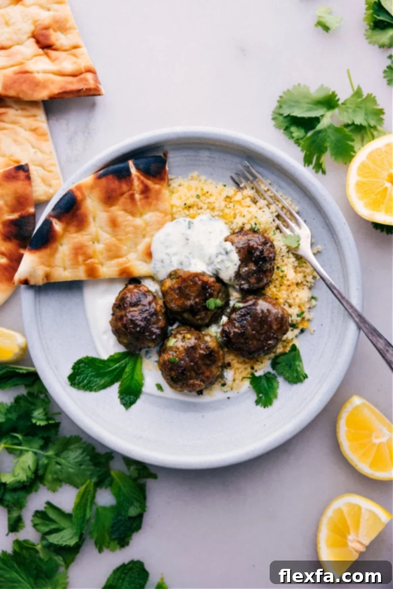 Flavorful Beef Kofta recipe, served with a refreshing mint yogurt sauce and a side of fresh veggies.