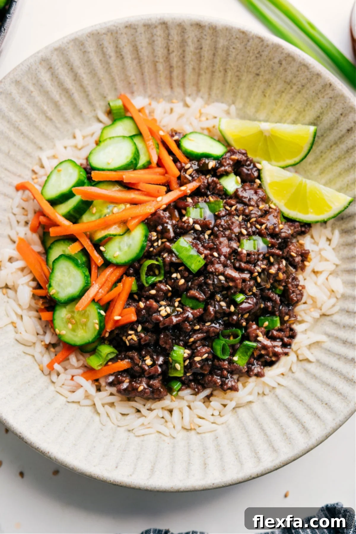 Vibrant Korean Ground Beef Bowls, beautifully layered with warm rice and tangy pickled vegetables.