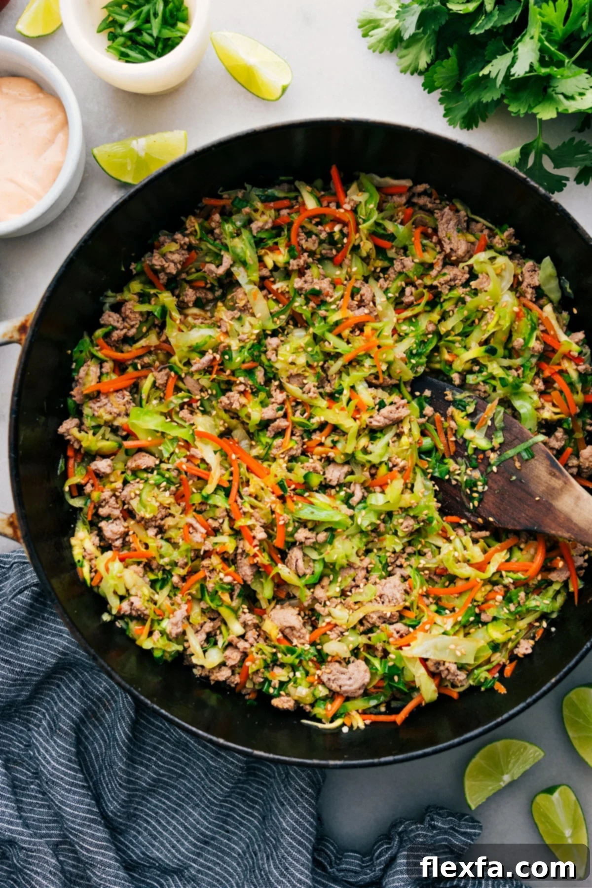 A vibrant Cabbage Stir Fry simmering in a pot, packed with ground beef or turkey, fresh vegetables, and a delicious stir-fry sauce.