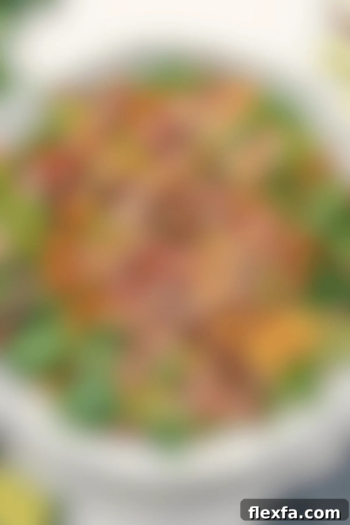 A hearty Wendy's Taco Salad copycat recipe, beautifully presented in a bowl and drizzled with a rich chili-lime dressing.