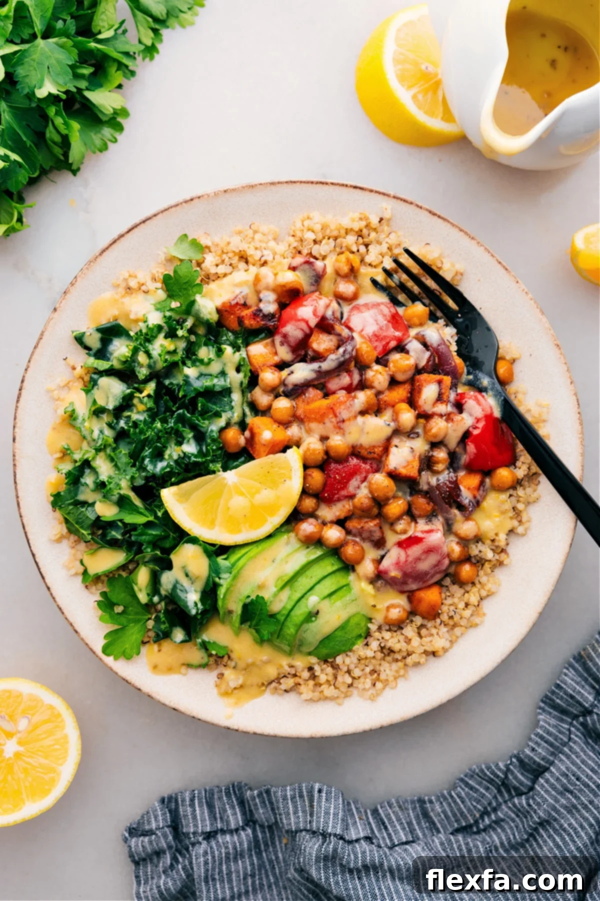 A vibrant and nutritious Buddha Bowl featuring roasted sweet potatoes, crispy chickpeas, quinoa, and a flavorful dressing.