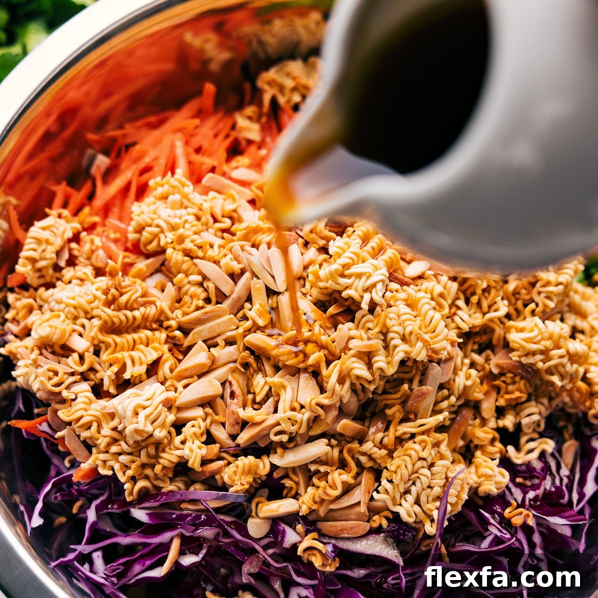 All the ingredients in this ramen noodle salad recipe added to a bowl and tossed with the dressing.