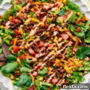 A serving of the finished Taco Salad Recipe in a white bowl.