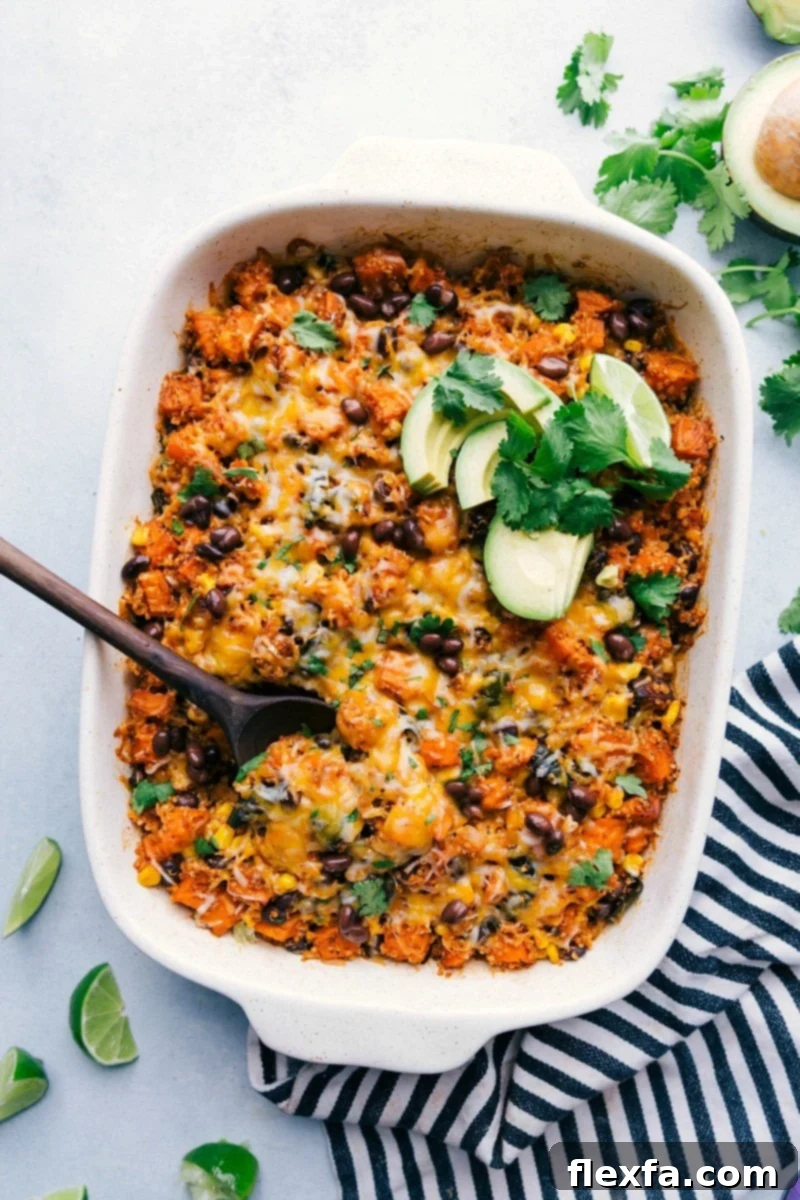 A freshly baked Quinoa Enchilada Bake casserole with melted cheese on top.