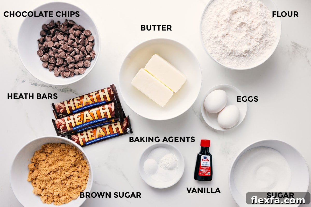 All the ingredients for this recipe for Macadamia Nut White Chocolate Cookies prepped and ready to assemble, including white chocolate, sugars, butter, eggs, flour, and baking agents.