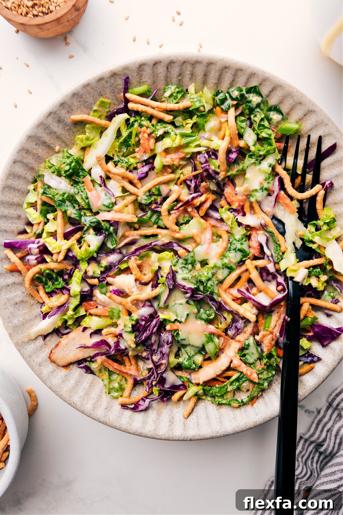 Asian chicken salad in a bowl dressed with the best creamy dressing.