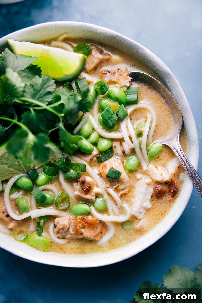 Green curry noodle soup in a bowl.