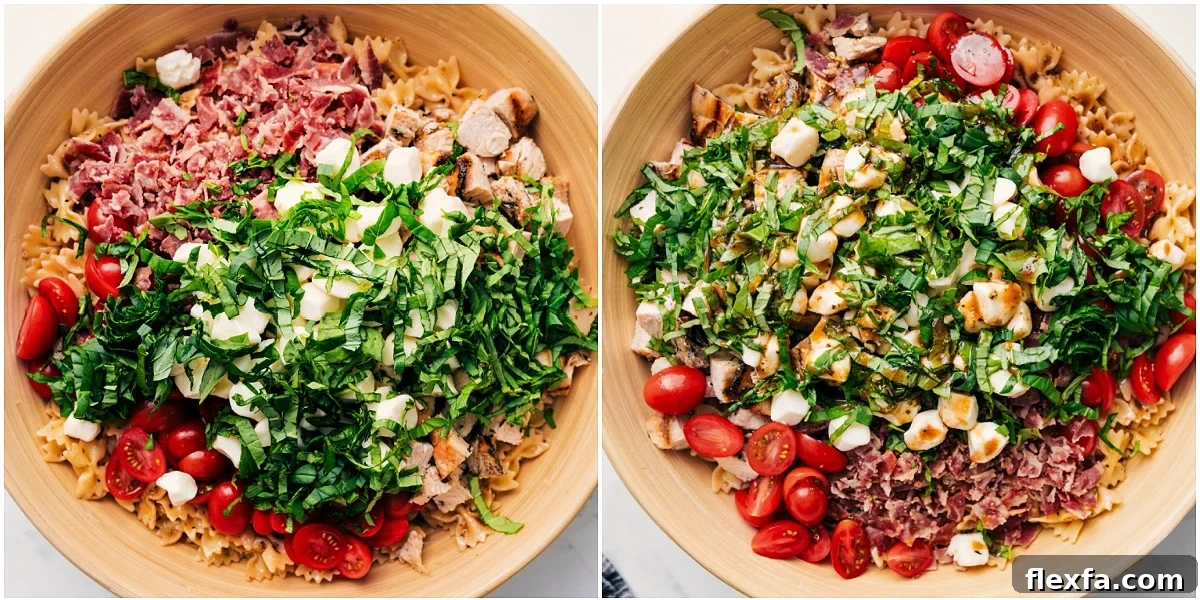 Fresh And Flavorful Caprese Pasta Salad Is The Perfect Summer Dinner The salad in a bowl with all the ingredients added in and the dressing drizzled on top.