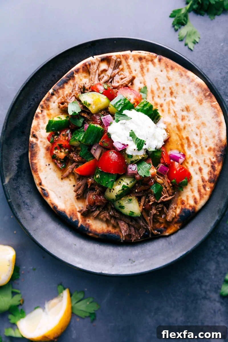 Shredded beef gyros tucked into warm pita and topped with cucumber tomato salad and creamy tzatziki sauce.