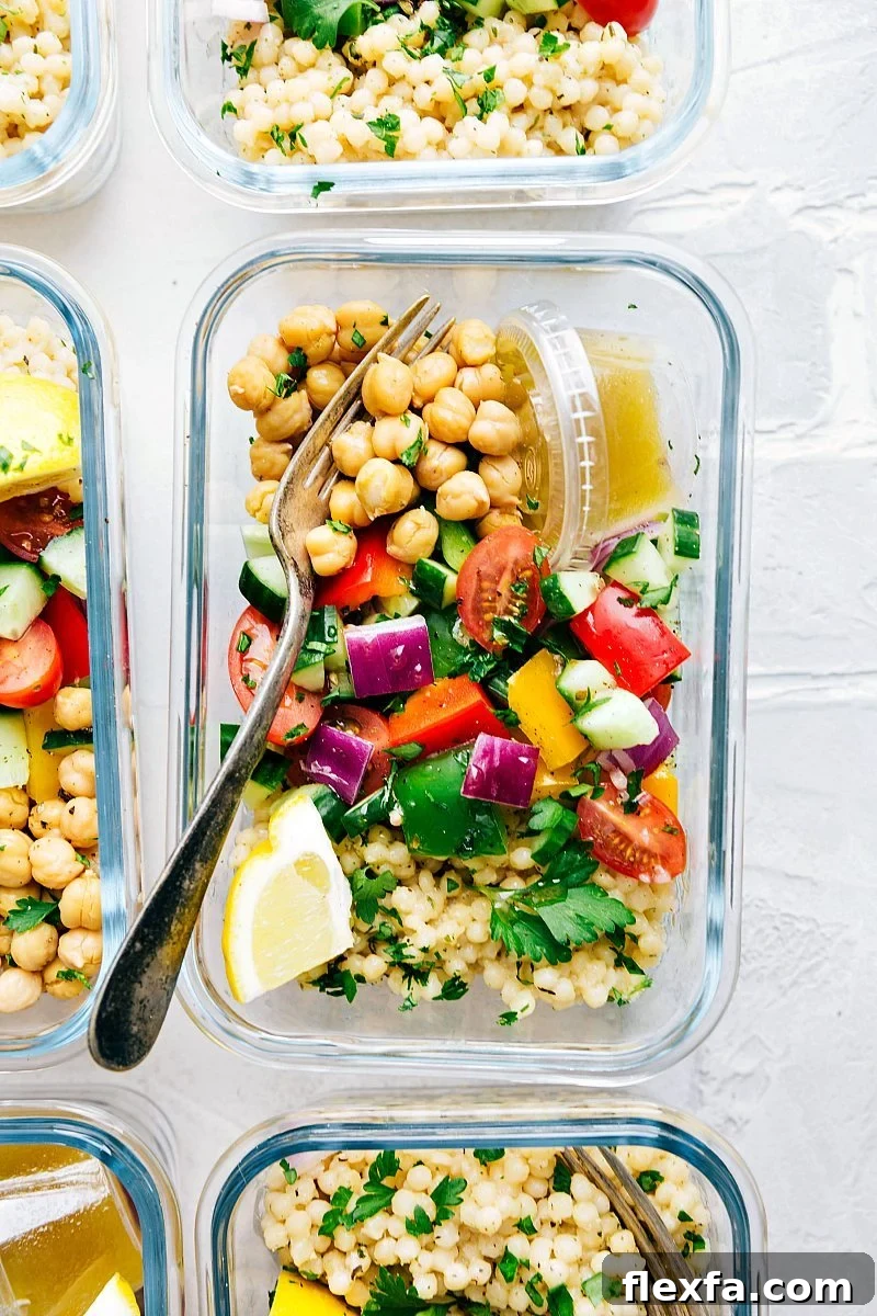 Greek couscous salad in a glass container for lunch.