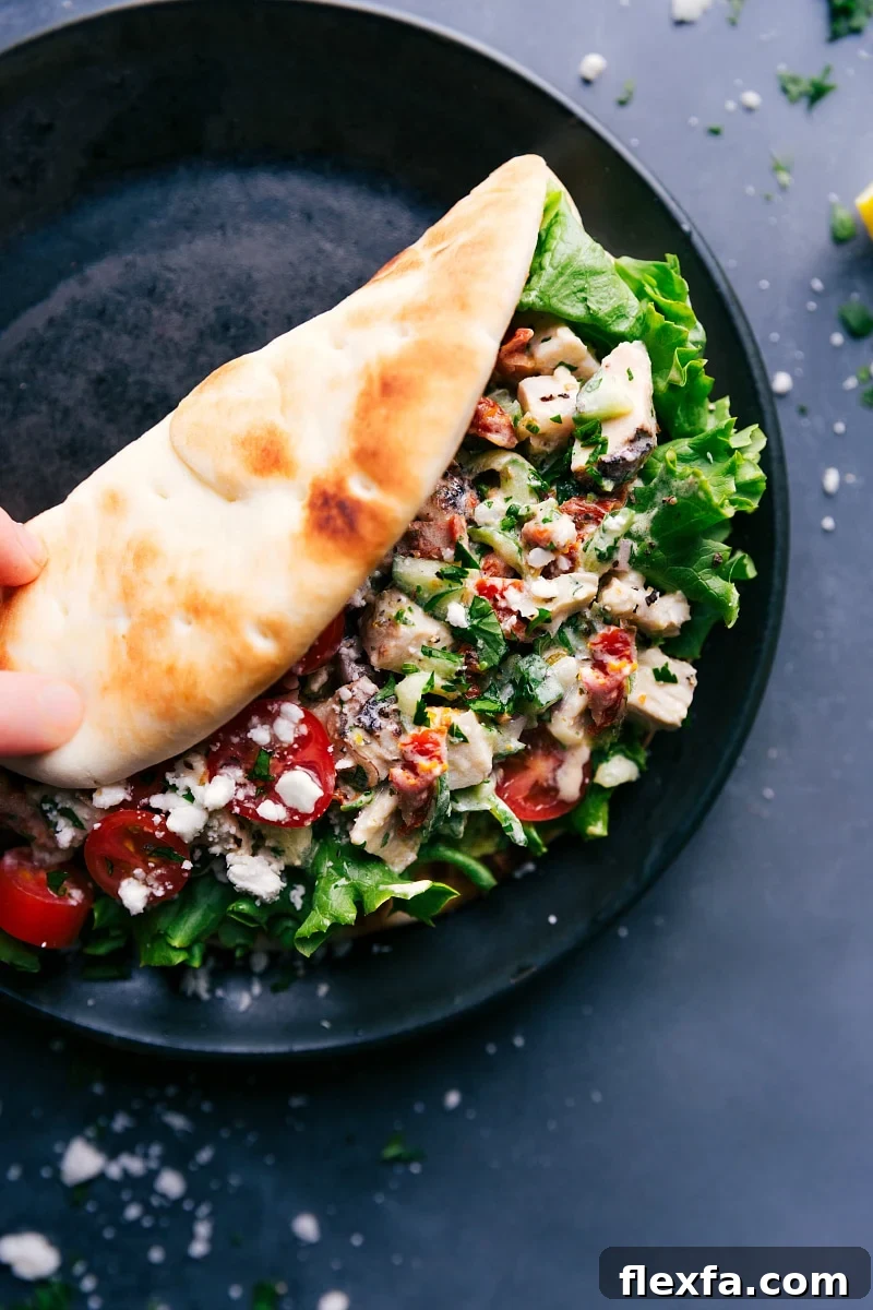 Greek chicken wrap tucked into warm pita and ready to enjoy.