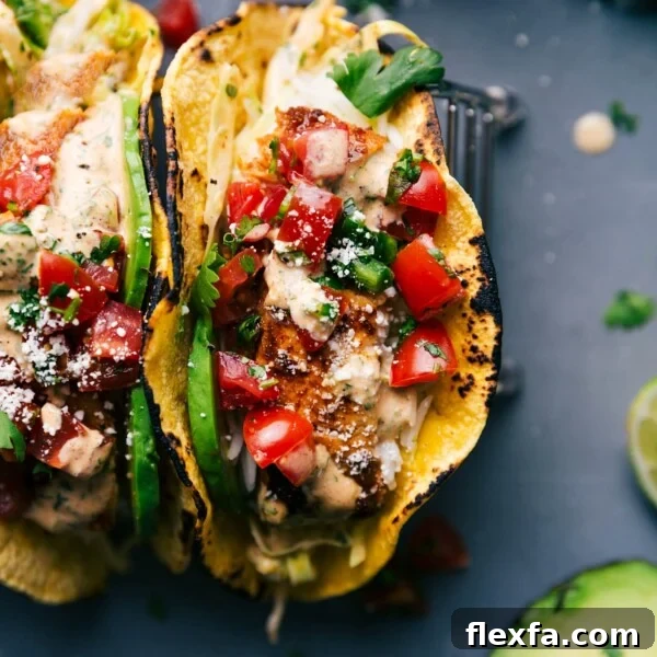 Two fish tacos stuffed with delicious toppings