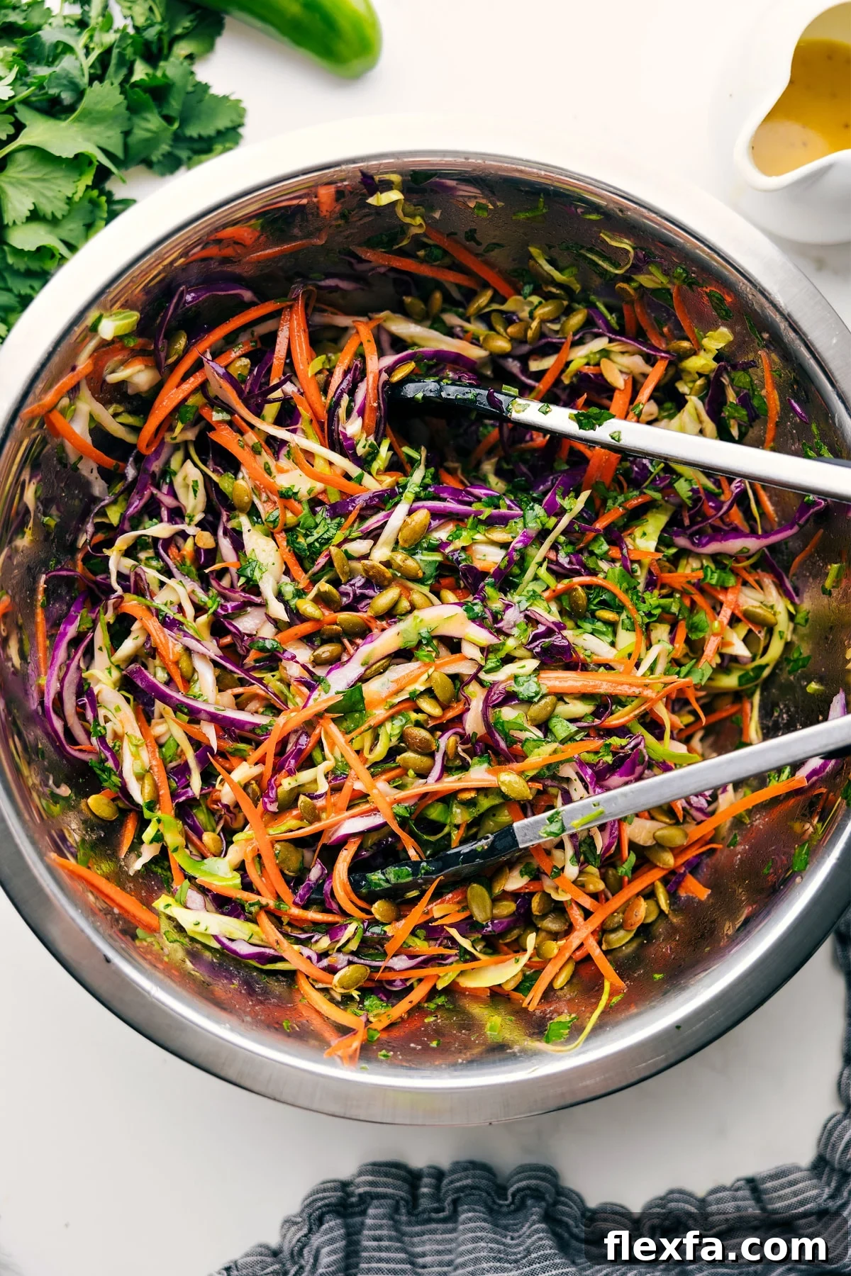 Healthy Slaw tossed in a large bowl and ready to serve.