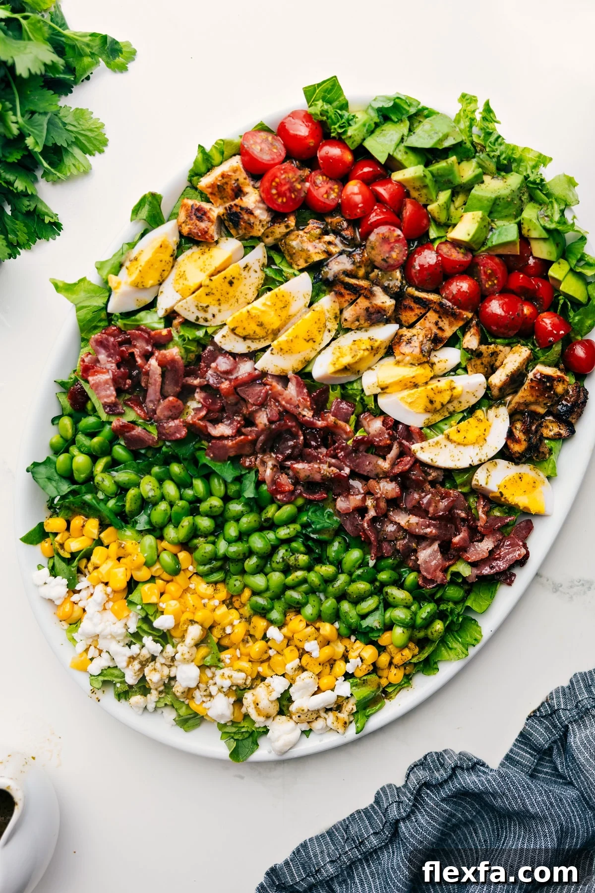 Cobb Salad Recipe served on a platter, dressed and ready to enjoy.