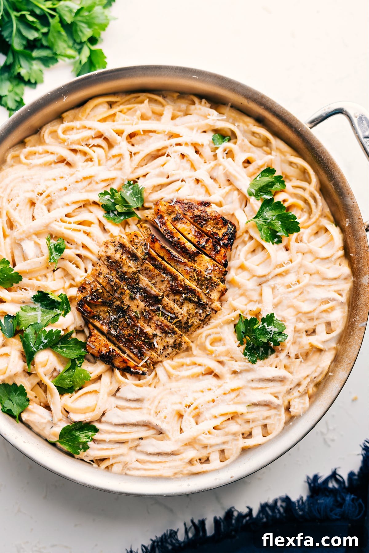 Creamy chicken Alfredo with tender chicken and pasta.