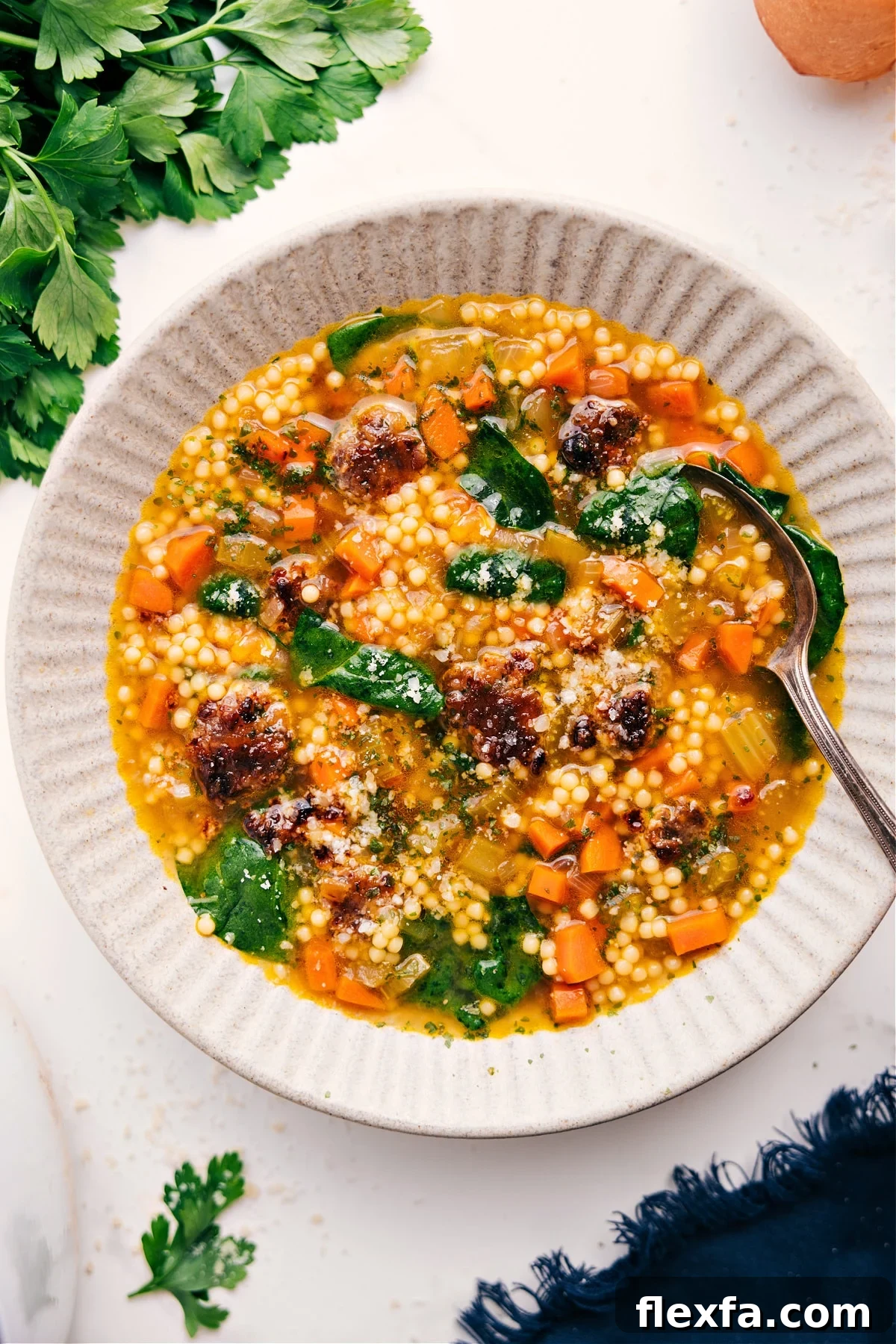 Italian recipes wedding soup with meatballs, pasta, vegetables, and rich broth.