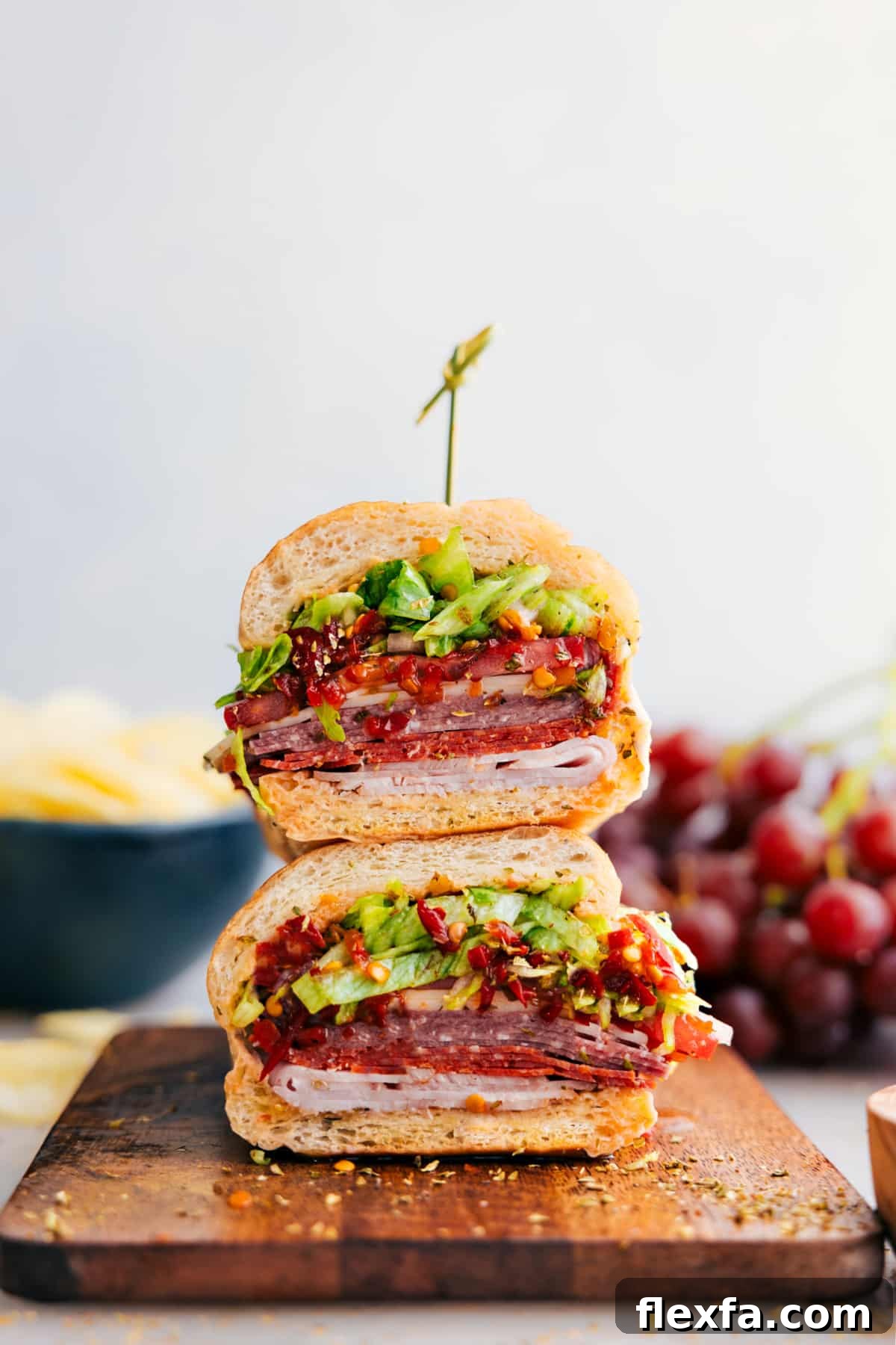 Hoagies stacked on top of each other ready to enjoy.