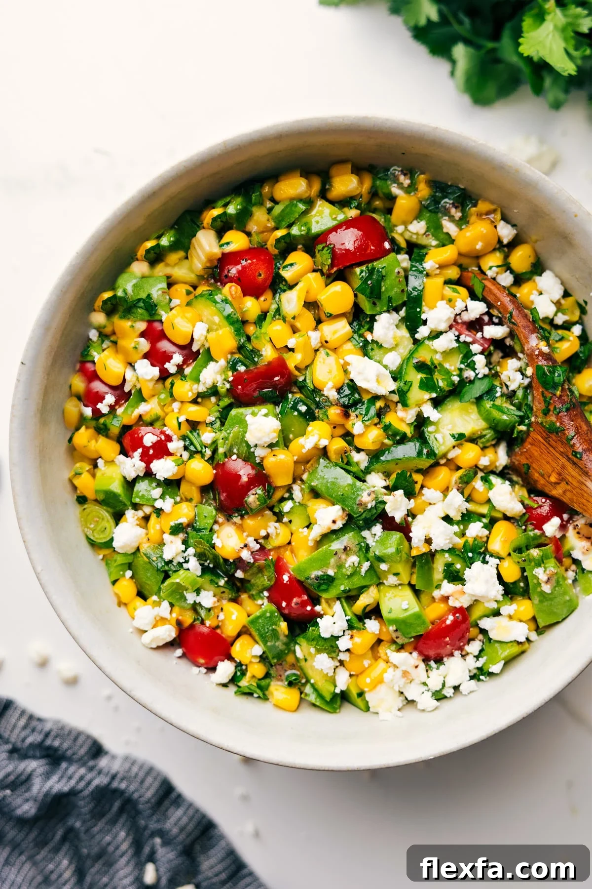 Corn Salad Recipe tossed together in a bowl and ready to serve.