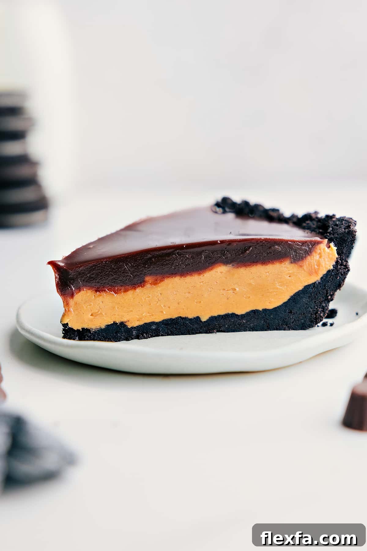 Chocolate Peanut Butter Pie Recipe slice on a plate ready to be enjoyed.