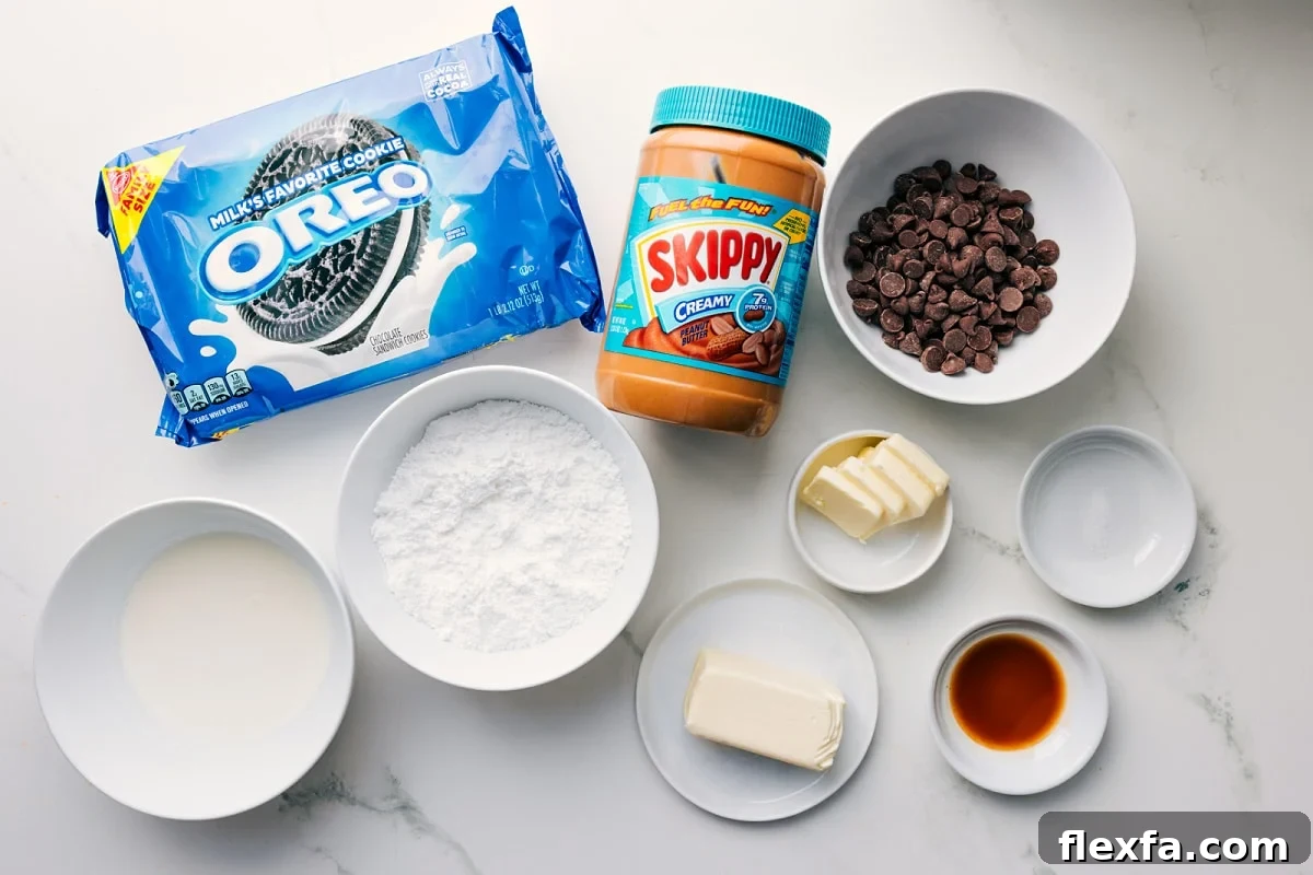 All the ingredients in this recipe prepped out for easy assembly including the Oreos, cream, butter, salt, creamy peanut butter, powdered sugar, and vanilla.