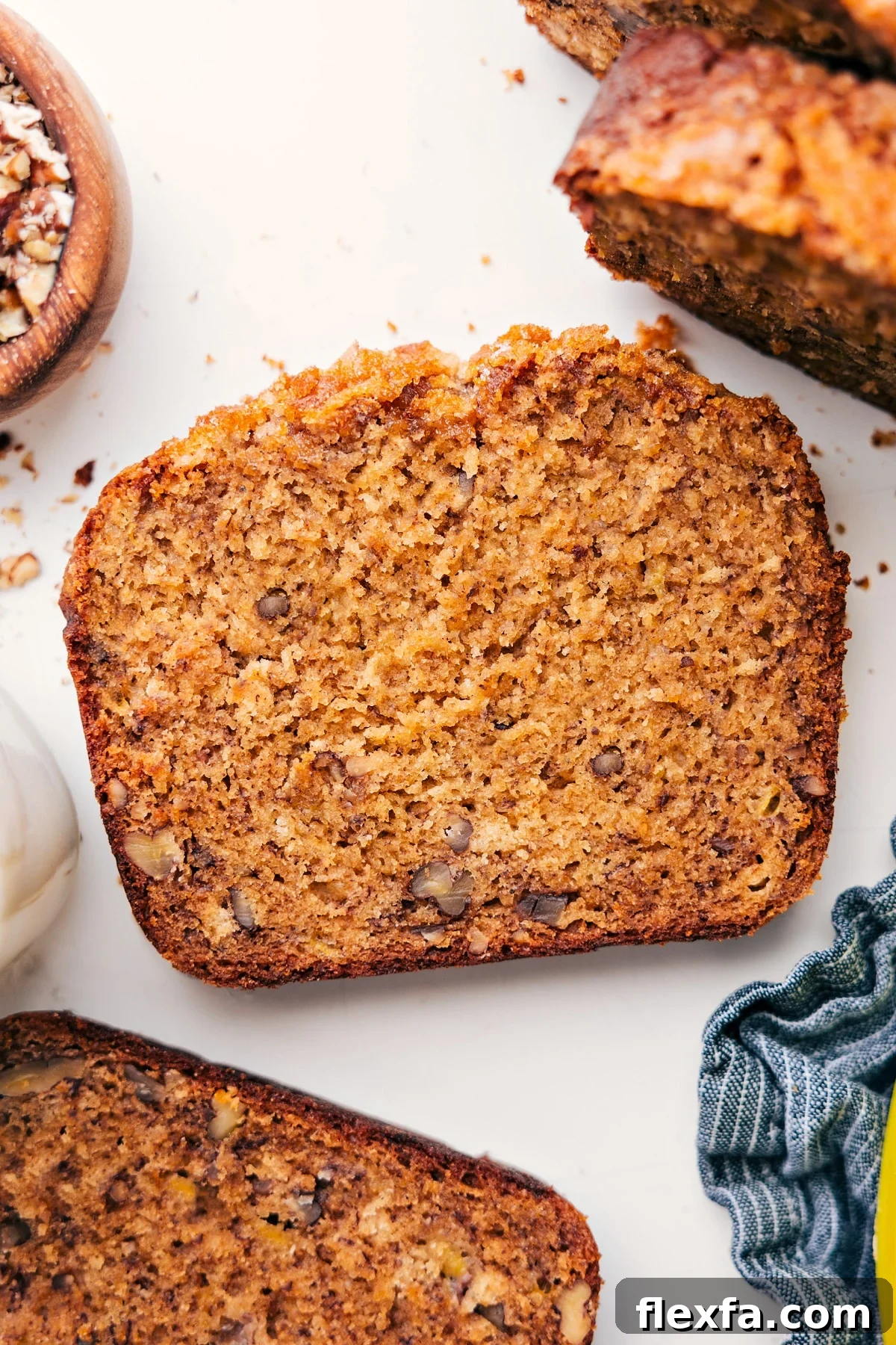 Slice of this banana nut bread recipe on a plate, ready to enjoy.