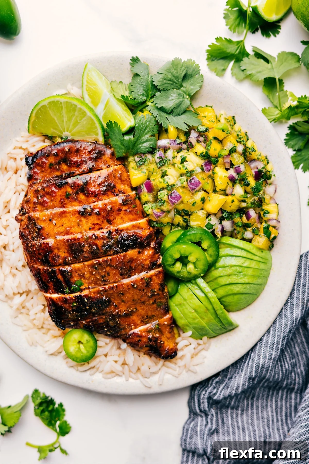 Pineapple chicken and rice topped with fresh pineapple salsa.