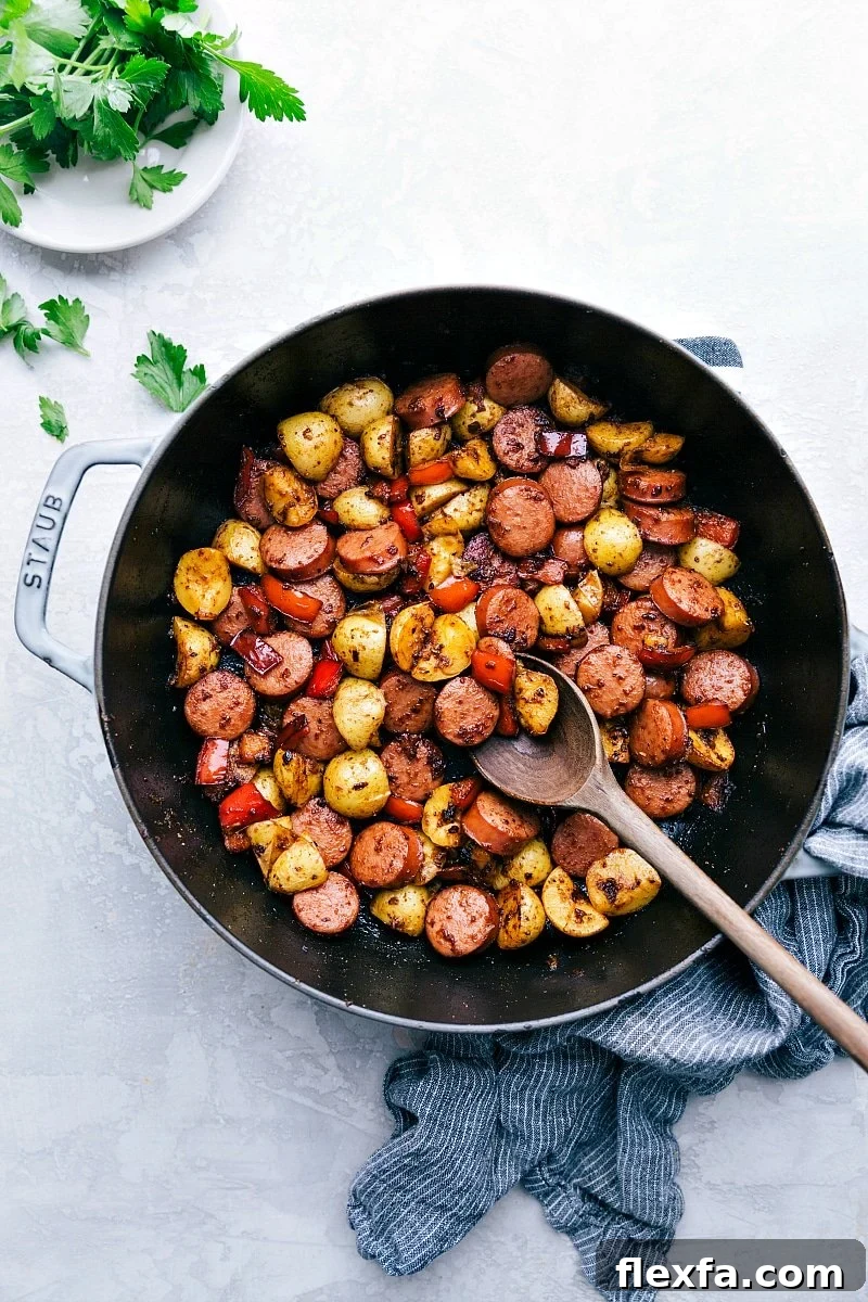 Sausage and potatoes skillet, one of the Best Recipes for Meal Prep, with peppers and herbs.