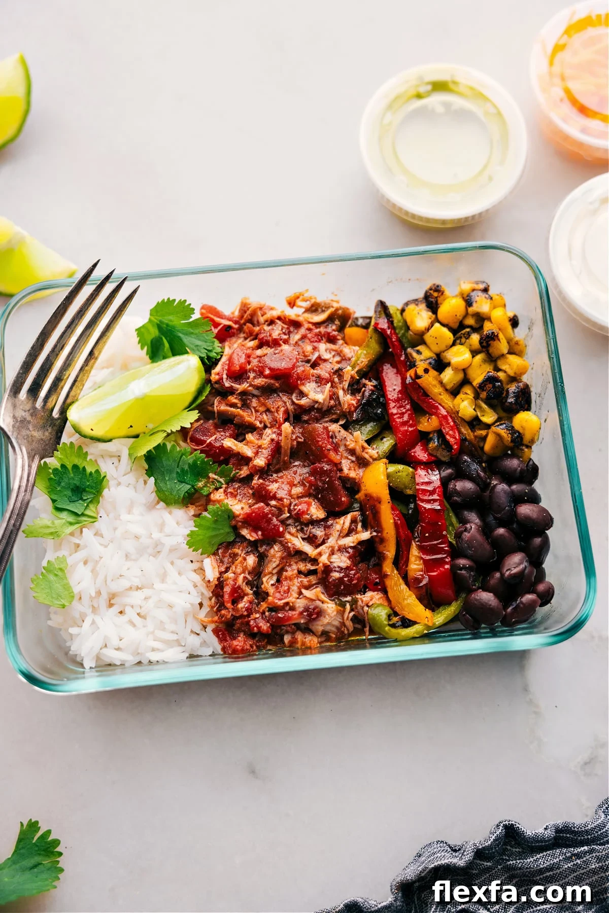 Crockpot salsa chicken, one of the Best Recipes for Meal Prep, portioned into glass containers