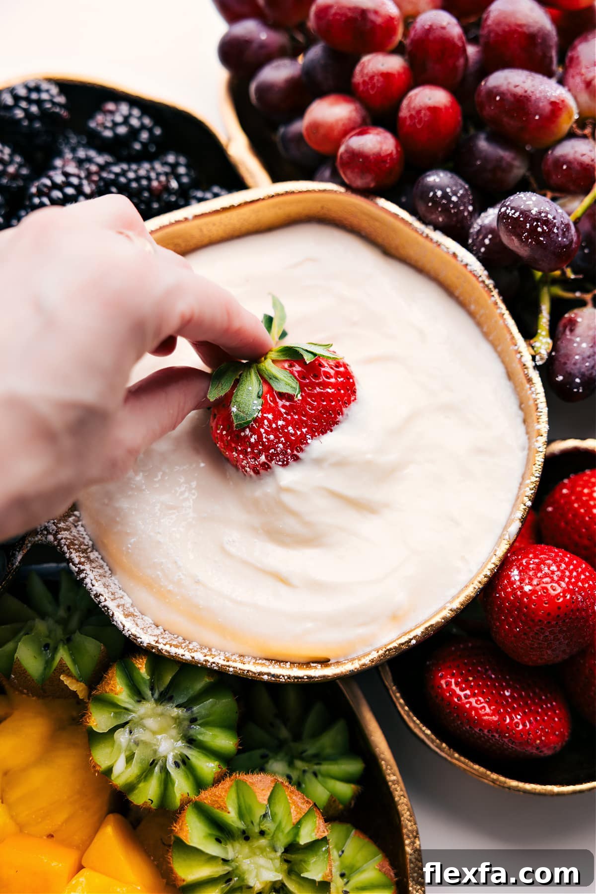 Creamy lime fruit dip served with a colorful assortment of fresh fruit.