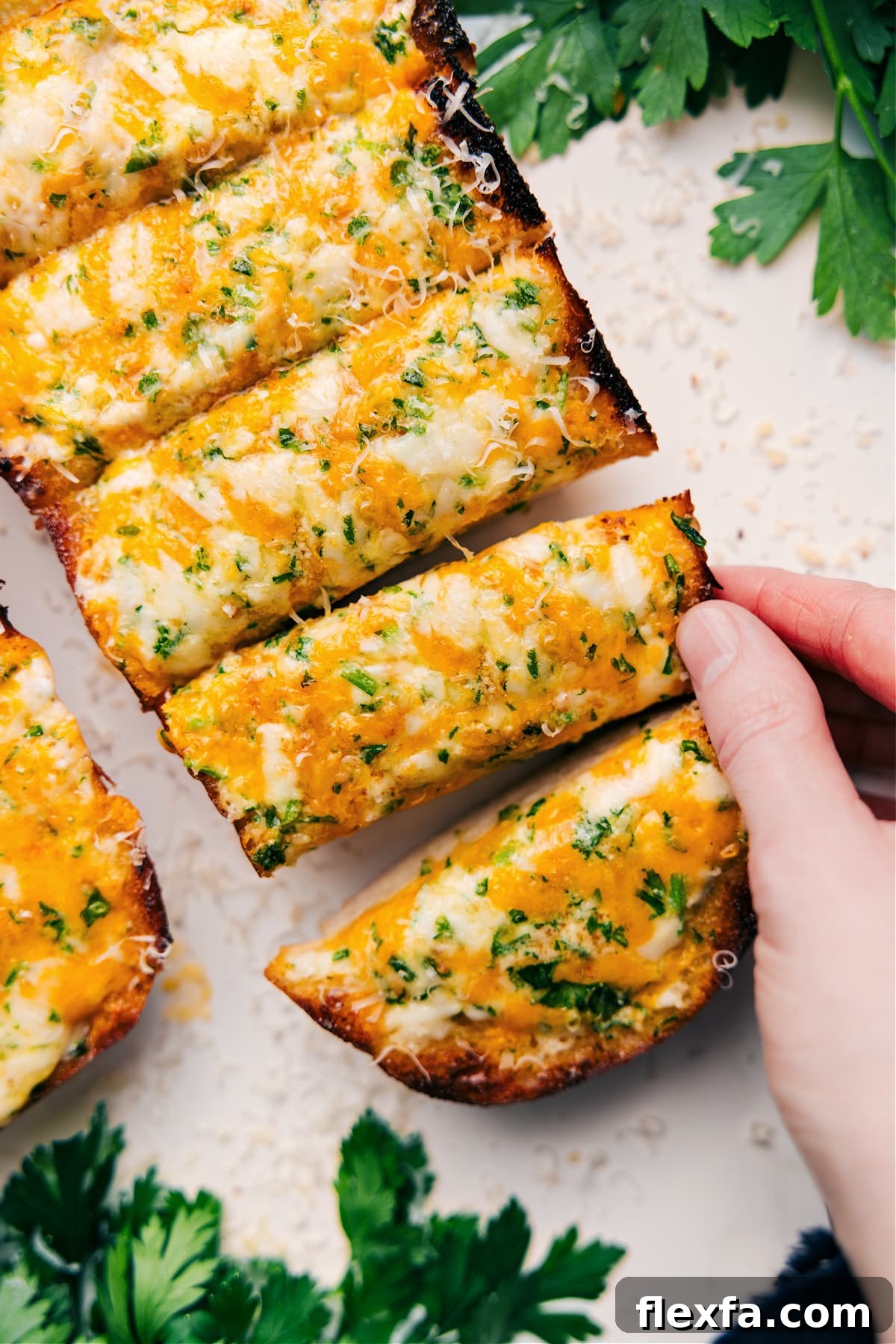 Garlic cheesy bread baked until golden and bubbly with deliciously crisp edges.