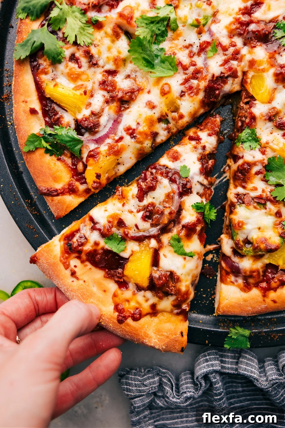 BBQ chicken pizza with pineapple, bacon, and melty cheese adds a fun option to easy recipes for kids.