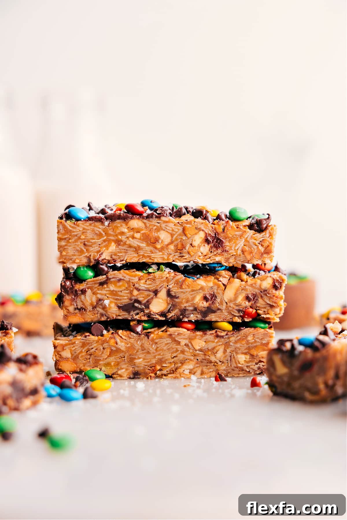 Homemade chewy granola bars with oats, peanut butter, cashews, M&M’s, and chocolate chips.