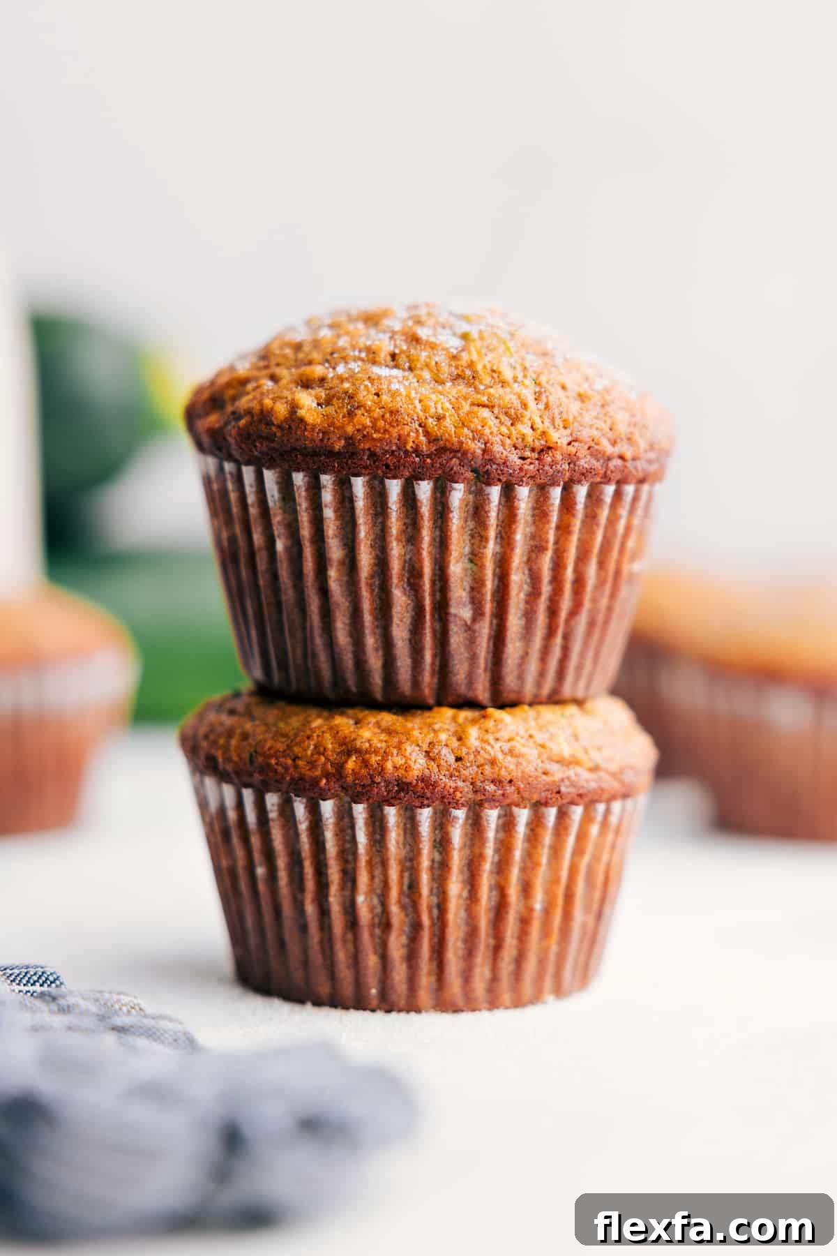 Banana zucchini muffins made with oats and Greek yogurt for easy recipes for kids at breakfast or snack time.