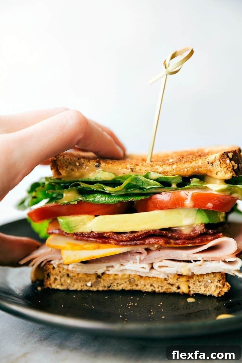 Club sandwich recipes layered with turkey, ham, bacon, Muenster cheese, and honey mustard.