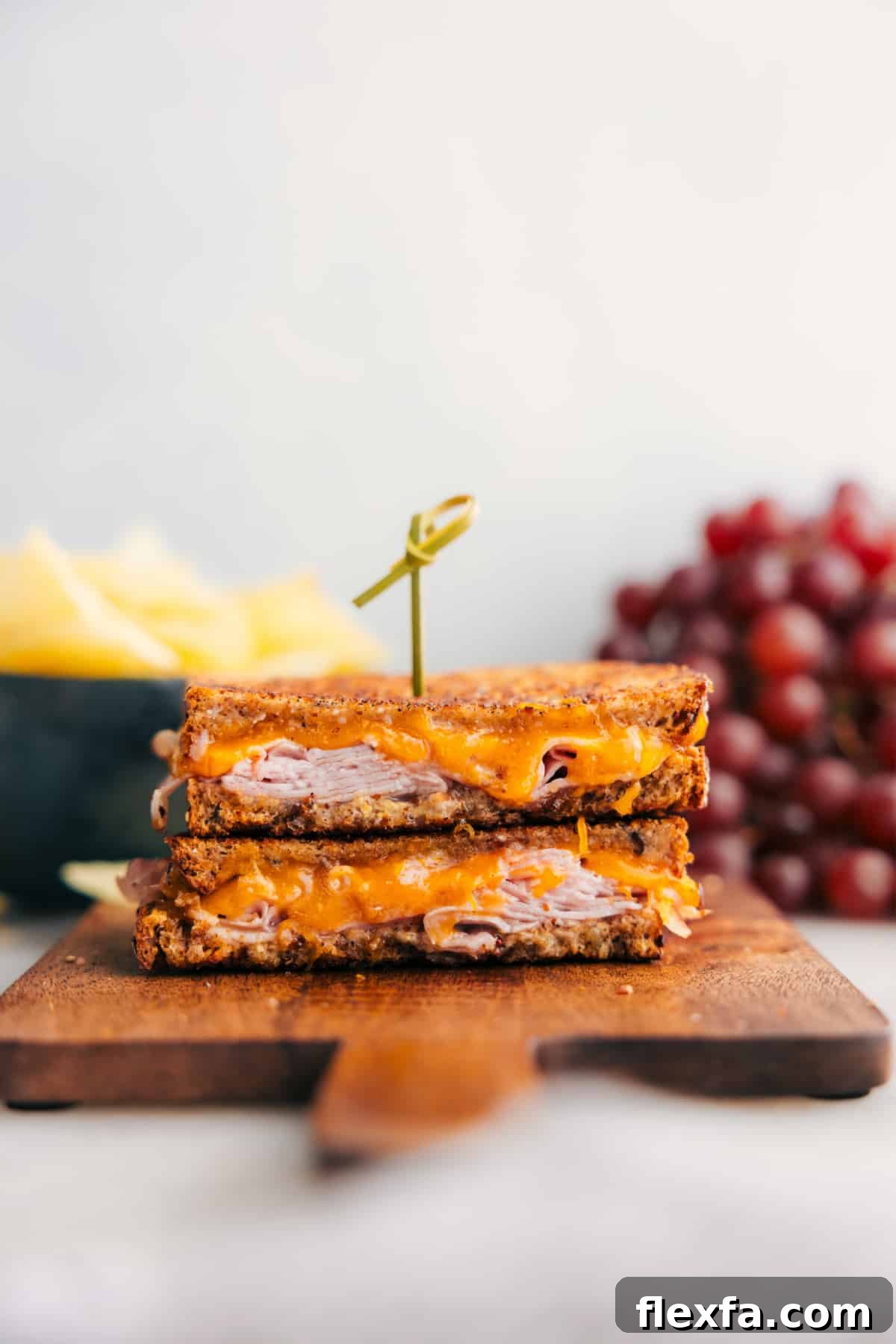 Ham and cheese sandwich with crispy buttered bread, deli ham, and melted Cheddar.