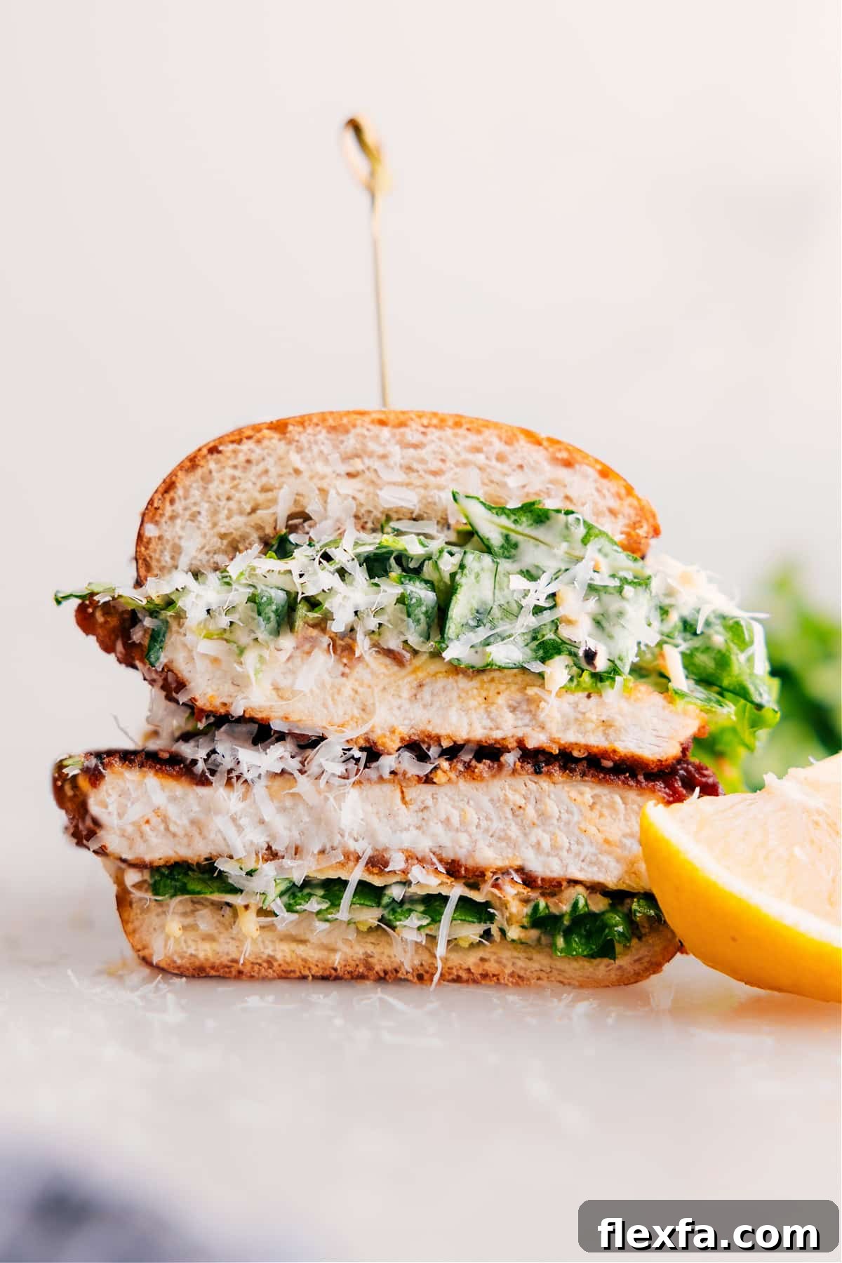Chicken Caesar sandwich with crispy chicken, Caesar salad, and a buttery roll.