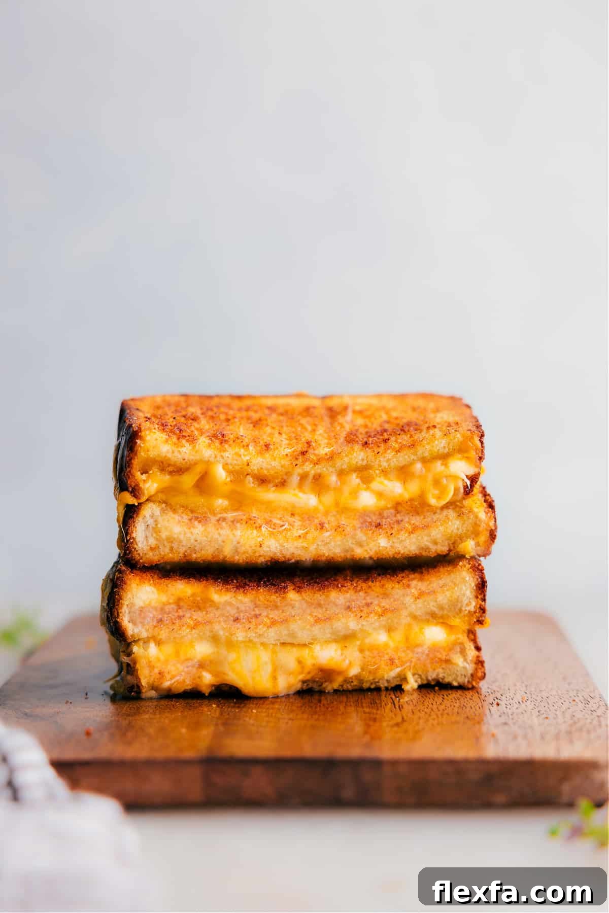 Grilled cheese with crispy bread and three layers of melted cheese.