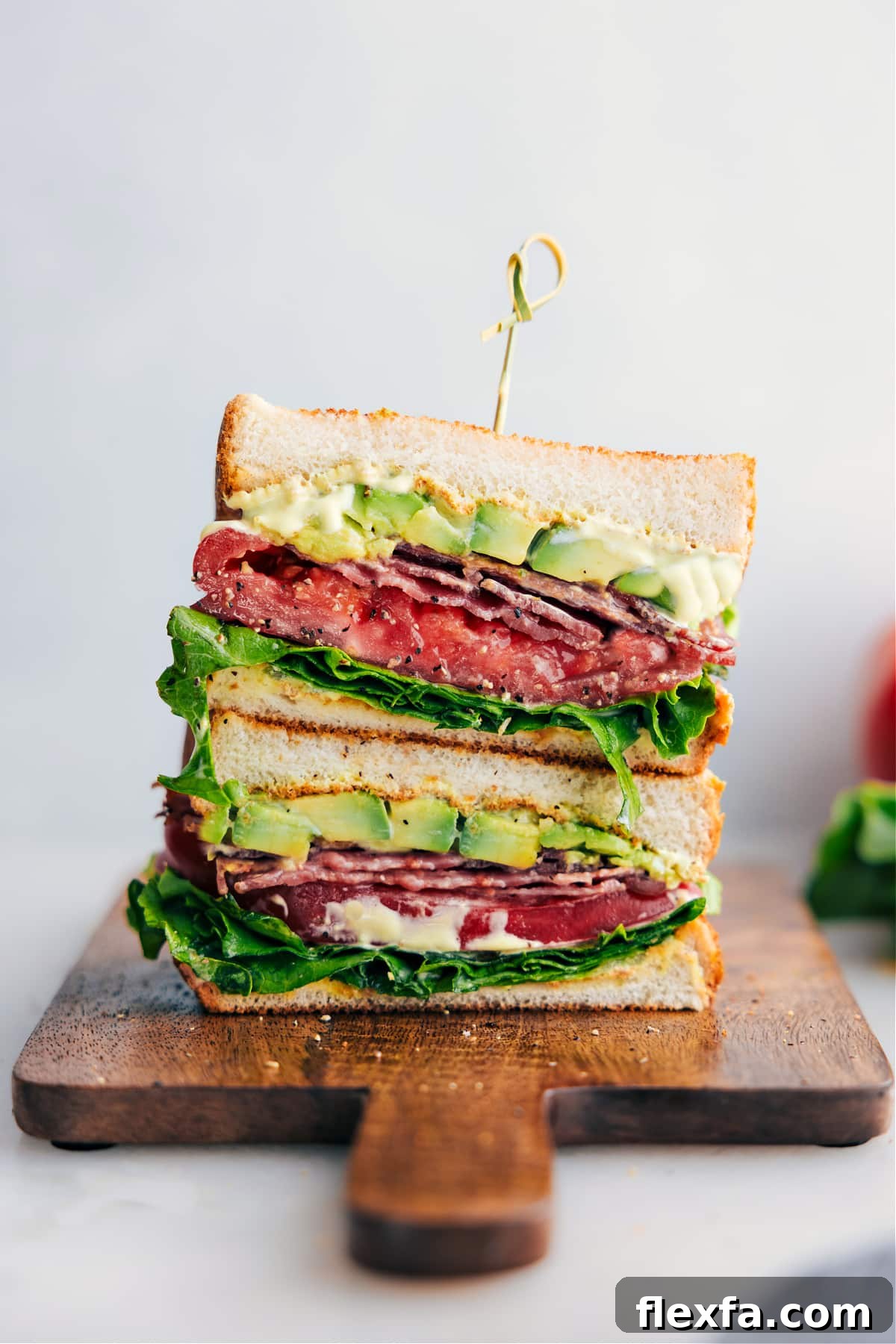 BLT sandwich recipes stacked with crispy bacon, lettuce, tomato, and creamy sandwich spread.