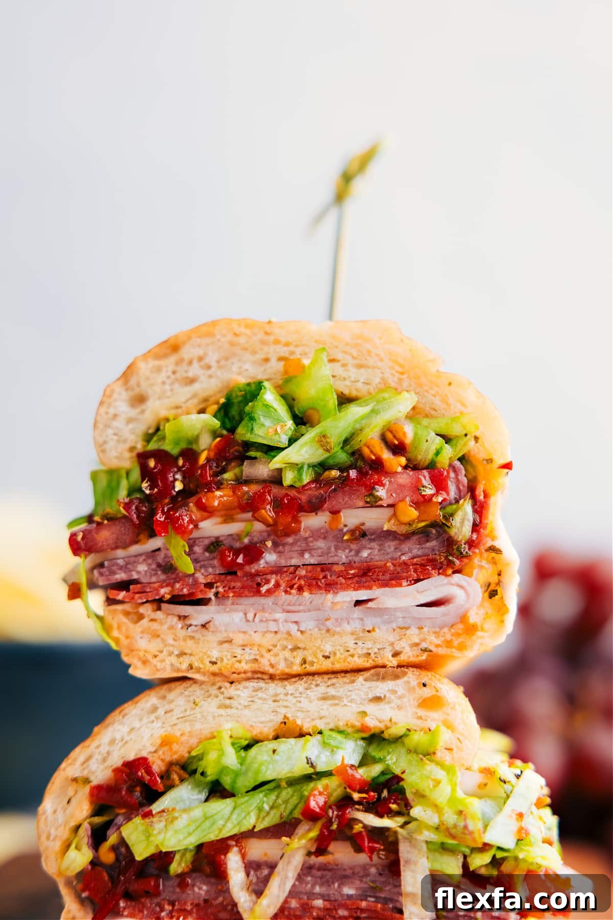 Italian hoagie with deli meats, provolone, tomatoes, onions, and lettuce.