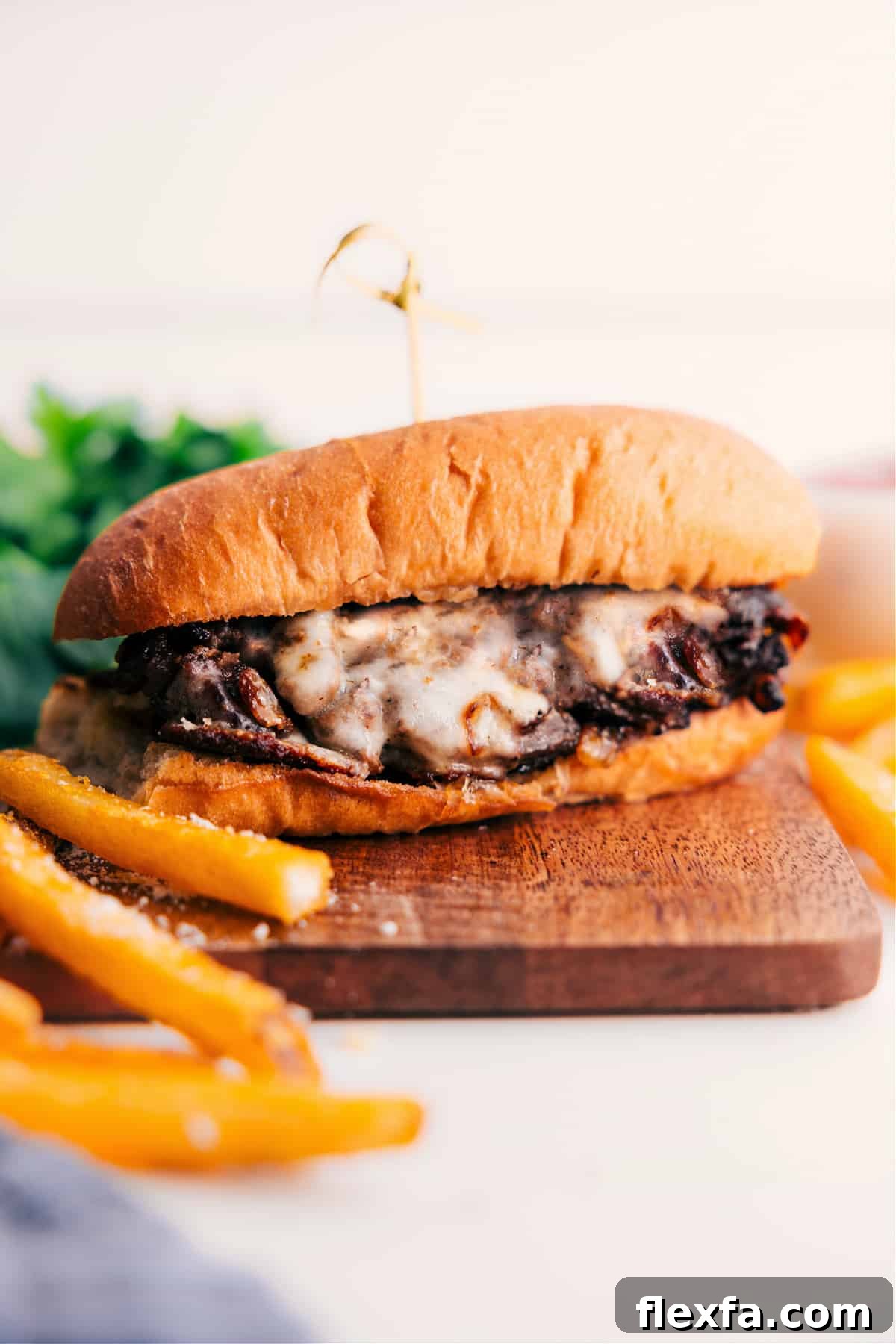 Philly cheesesteak with thinly sliced beef, caramelized onions, and melted provolone.