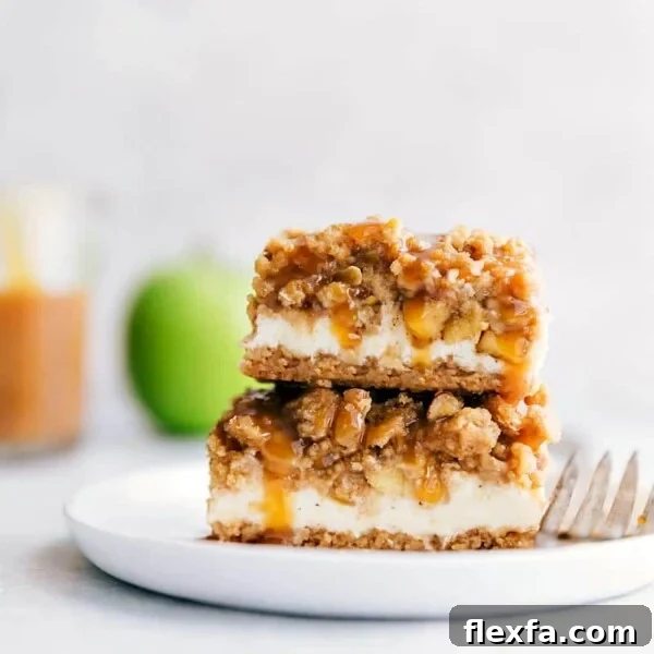 A stack of caramel apple cheesecake bars with mouth-watering layers.