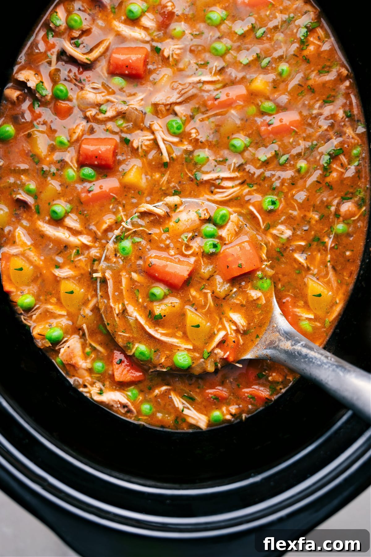 Crockpot chicken stew with tender chicken and vegetables in a rich savory broth.