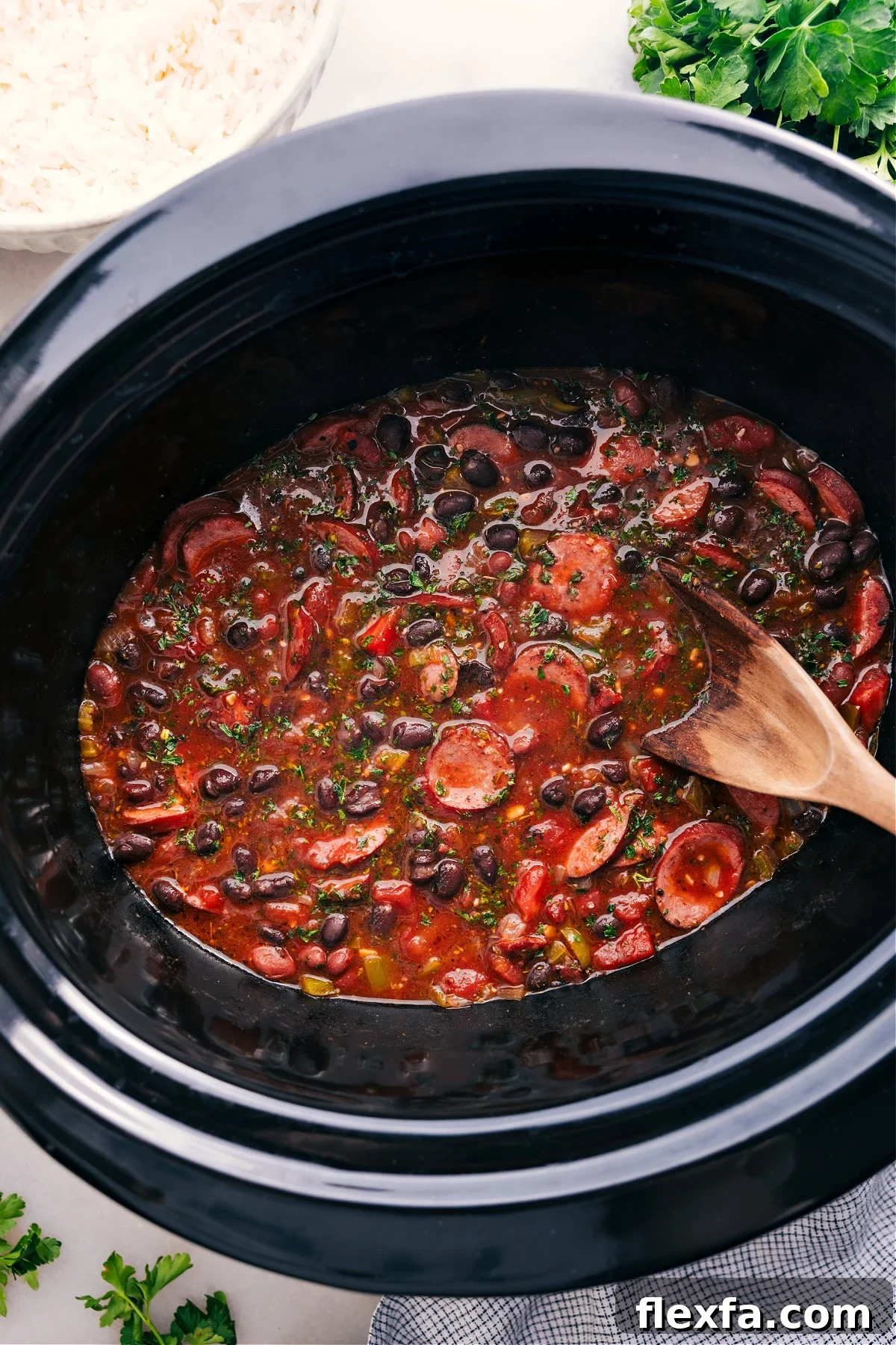 Easy crockpot meals featuring black beans an sausage in the slow cooker.