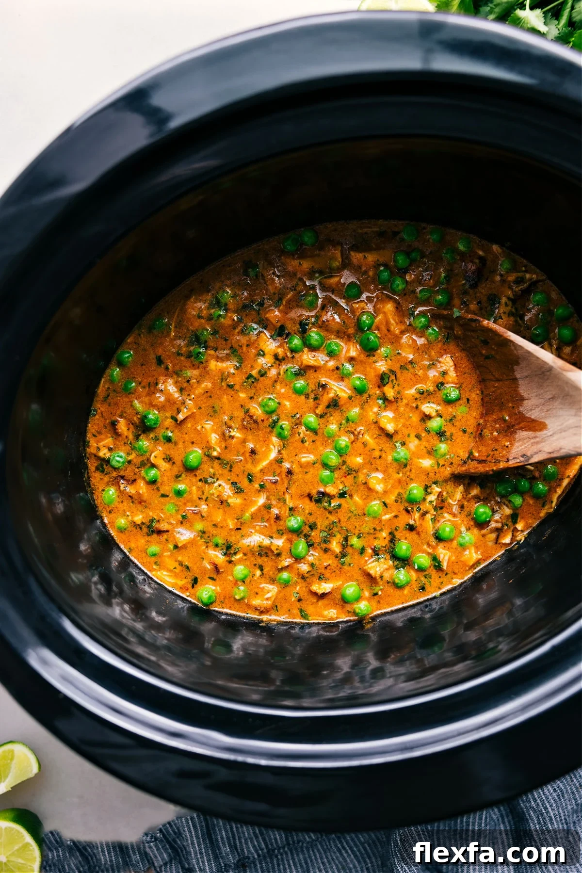 Crockpot Curry Chicken with tender chicken and sweet peas in a creamy coconut curry sauce.
