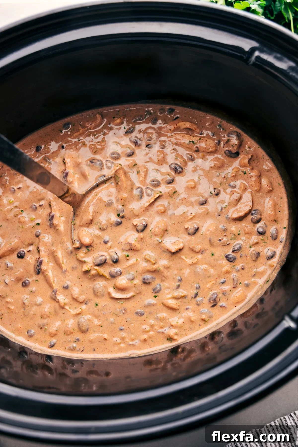 Easy crockpot meals featuring Green Chicken Enchilada Soup with tender chicken and a creamy green chile broth.