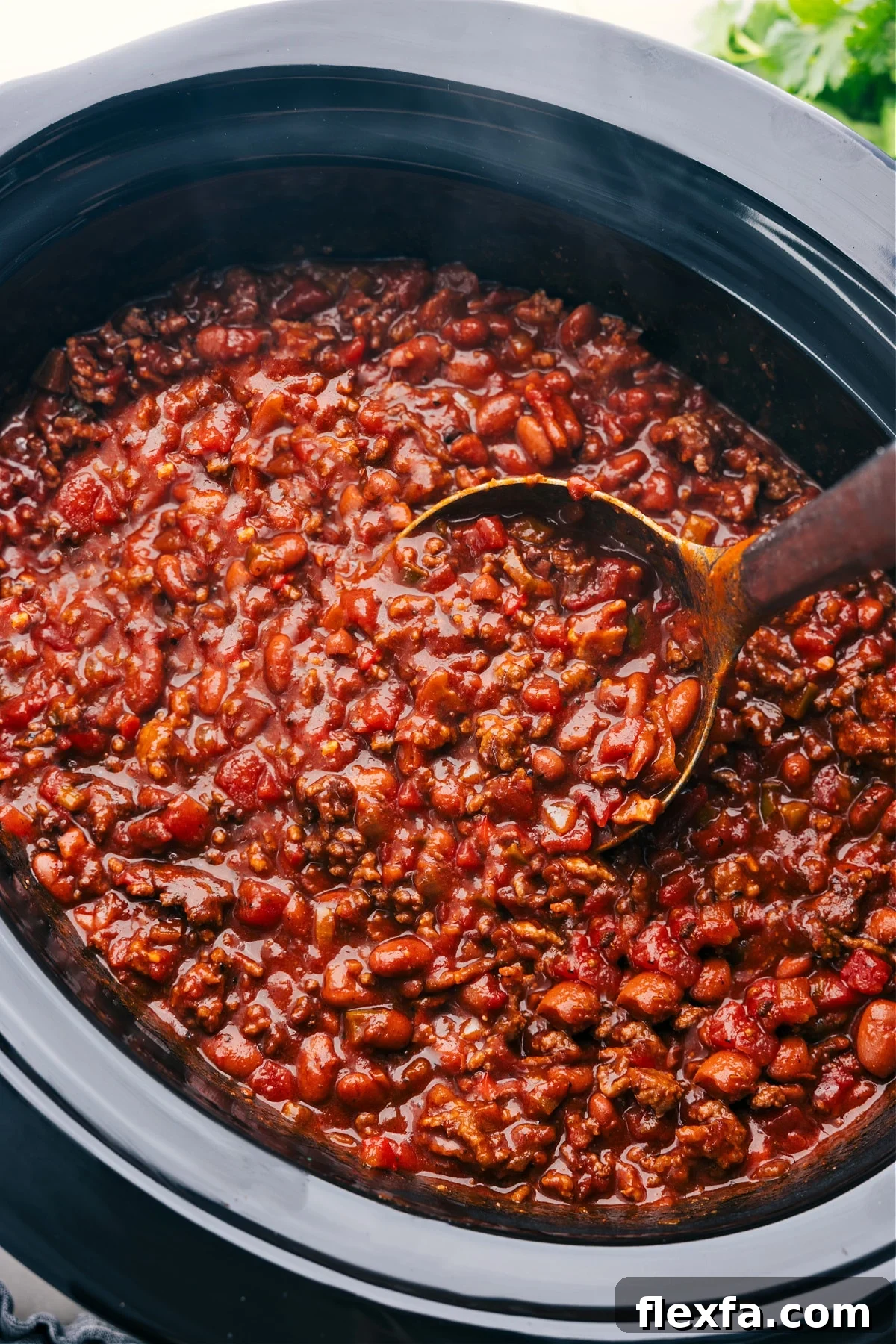 Crockpot chili still in the slow cooker ready to be served and enjoyed.