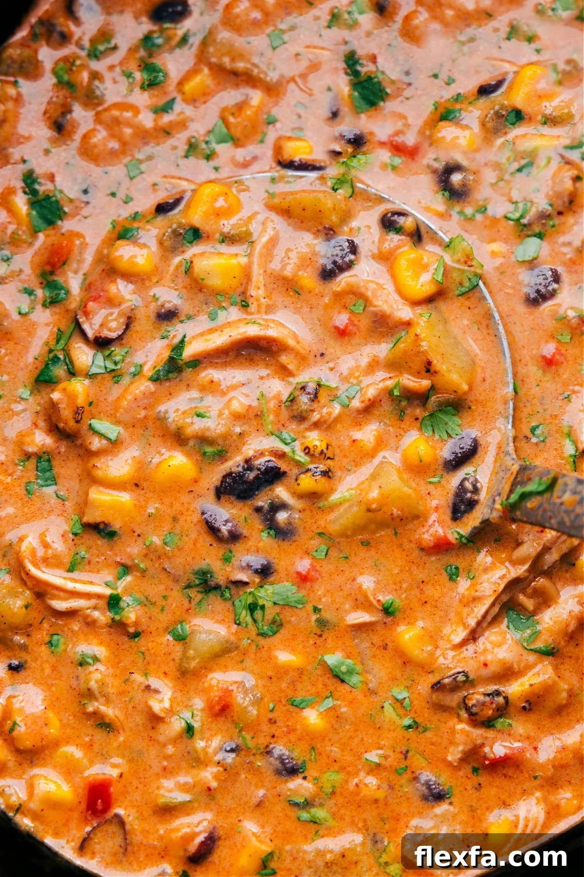 Easy crockpot meals: Creamy Southwest Corn Chowder with chicken, fire-roasted corn, beans, peppers, and fresh herbs.